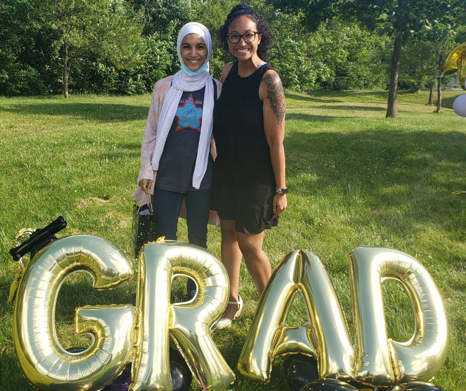 Participant and staff at graduation celebration