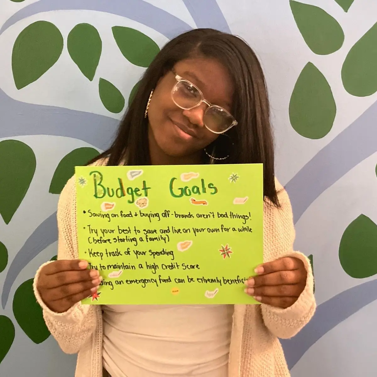 Participant holding writeup of budget goals