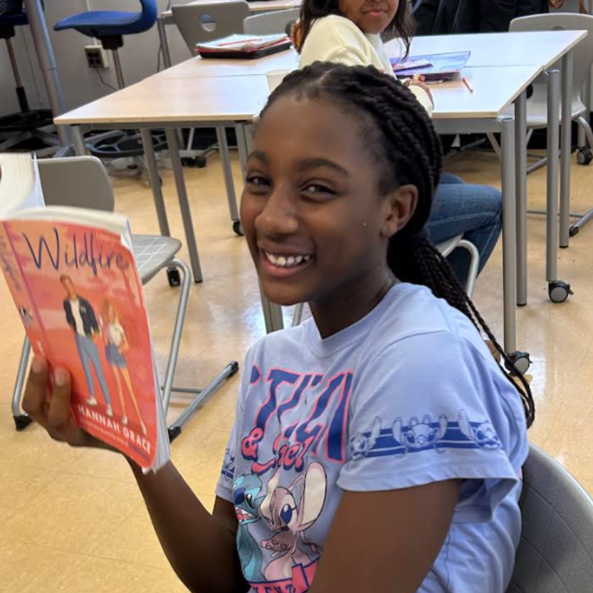 Nyla holding a book