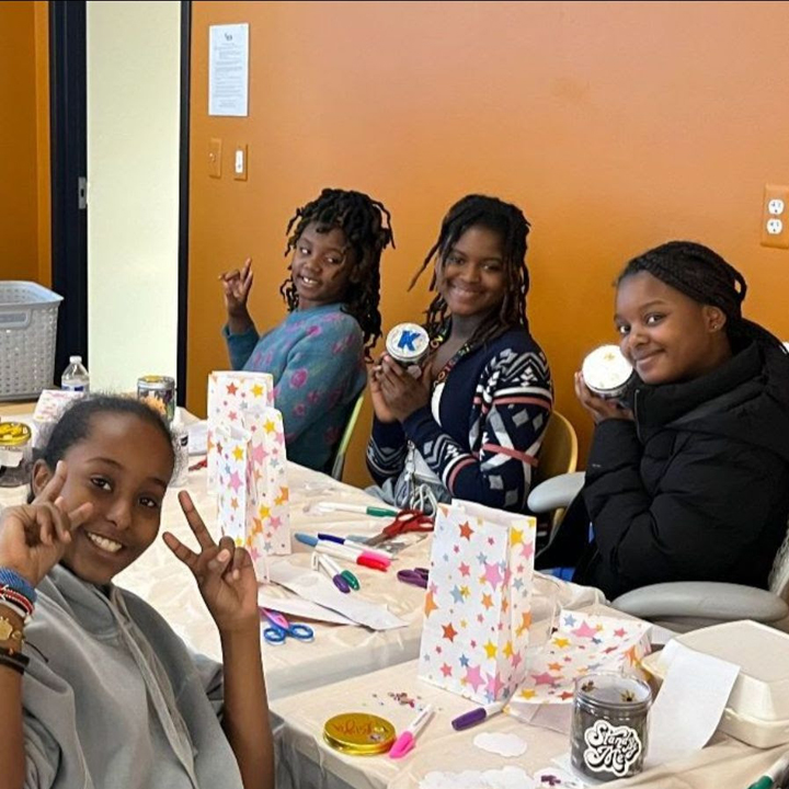 Participants sitting around craft table